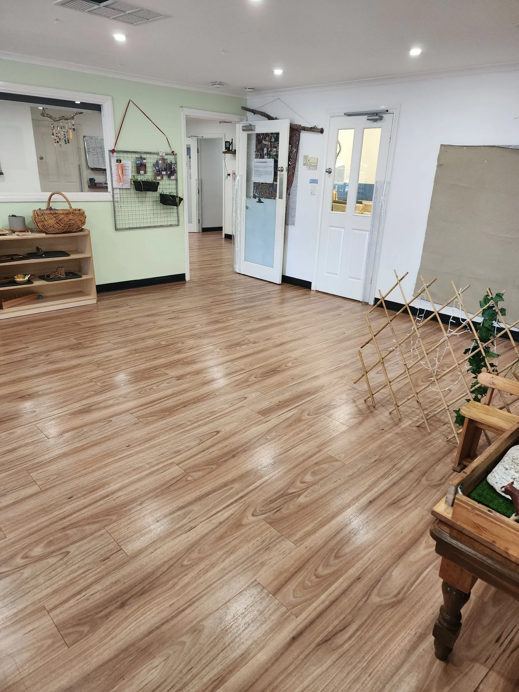 Bright childcare room with a clean timber-look floor