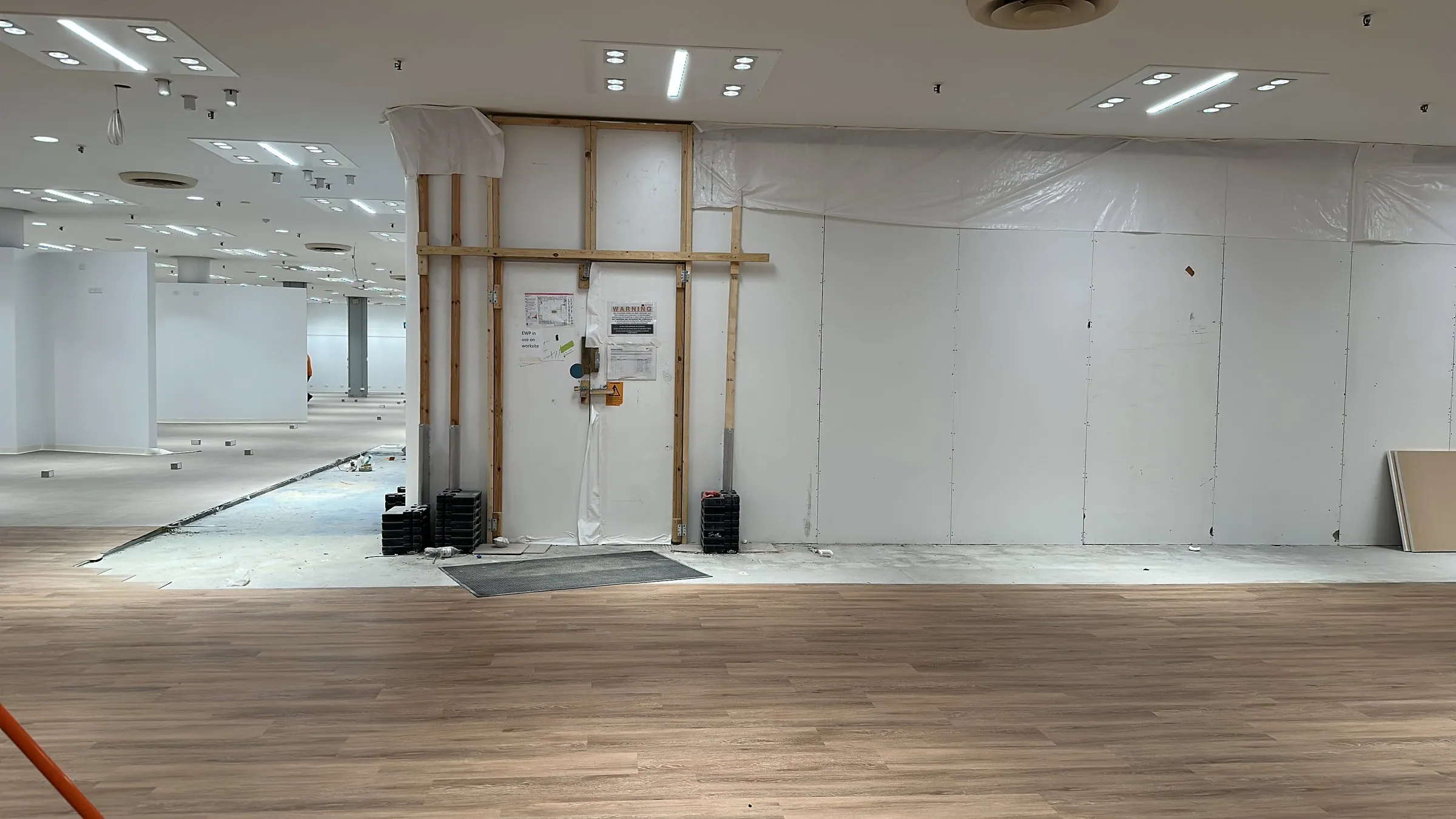 Empty office with a timber-look floor after a clean