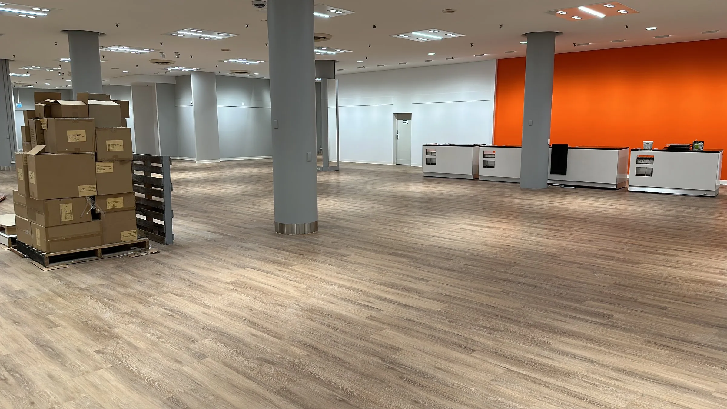 Open office floor plate with an orange feature wall