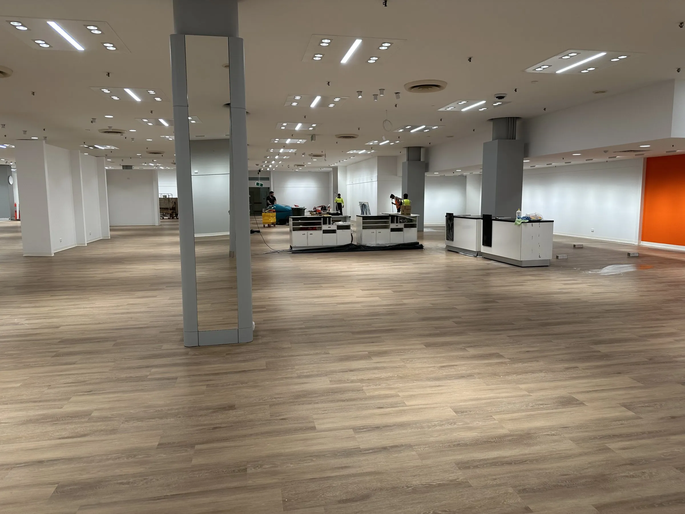 Large empty fit-out floor with pillars after a final clean