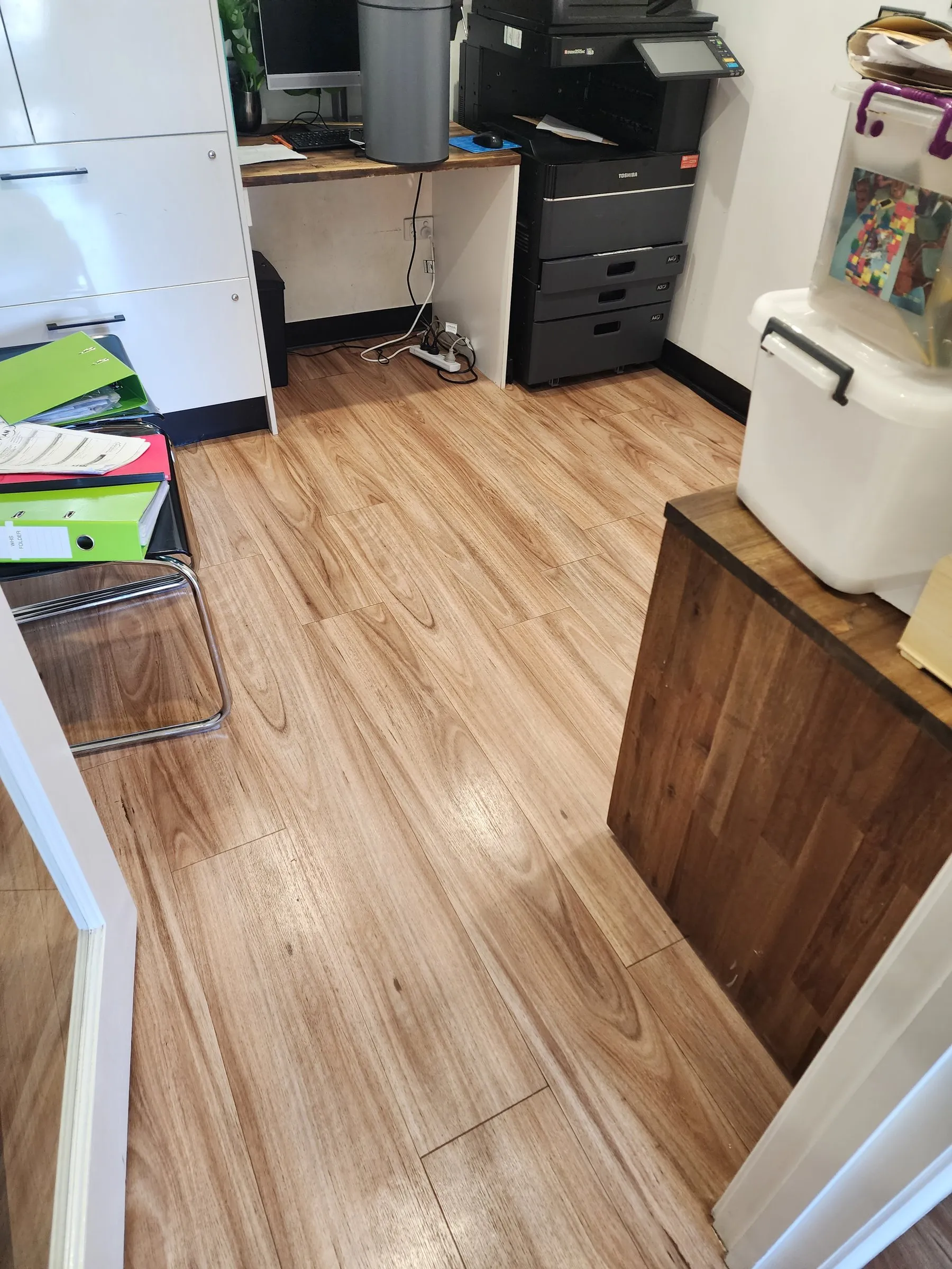 Office utility room with a clean timber-look floor