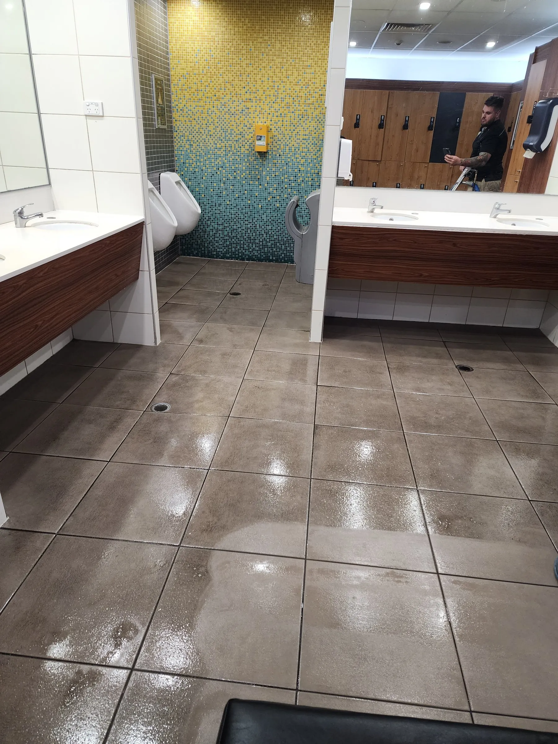 Clean washroom with a shining tile floor and vanity